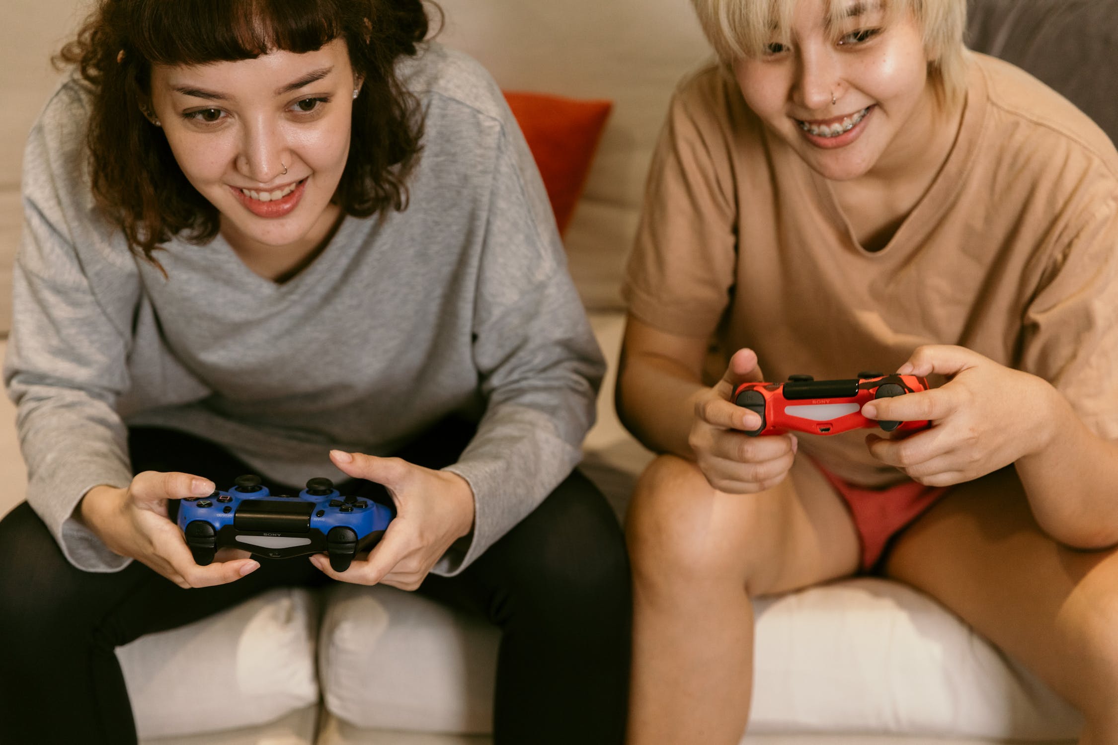 two girls playing a games console